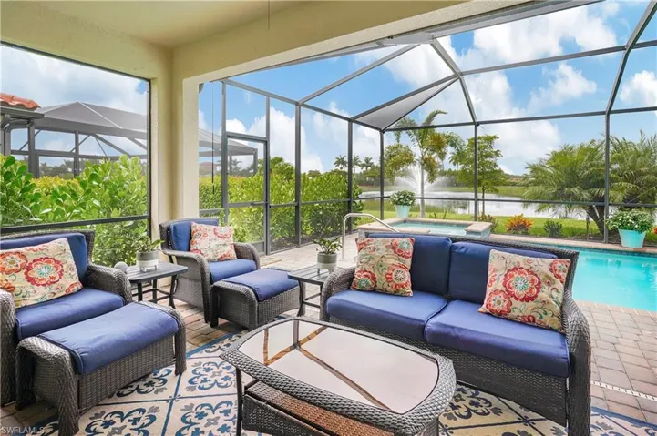 Sunroom with a healthy amount of sunlight and a water view