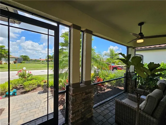 Sunroom featuring a healthy amount of sunlight and ceiling fan