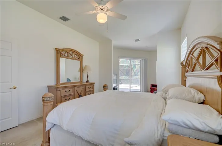 master with ceiling fan, carpet floors, and access to exterior