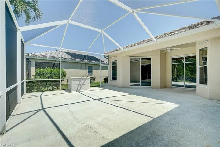 Unfurnished sunroom with ceiling fan