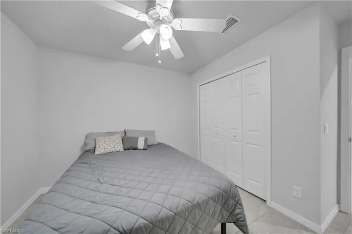 Bedroom featuring a closet and ceiling fan