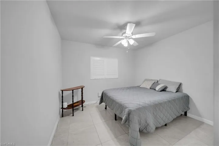 Bedroom featuring ceiling fan and light tile patterned floors
