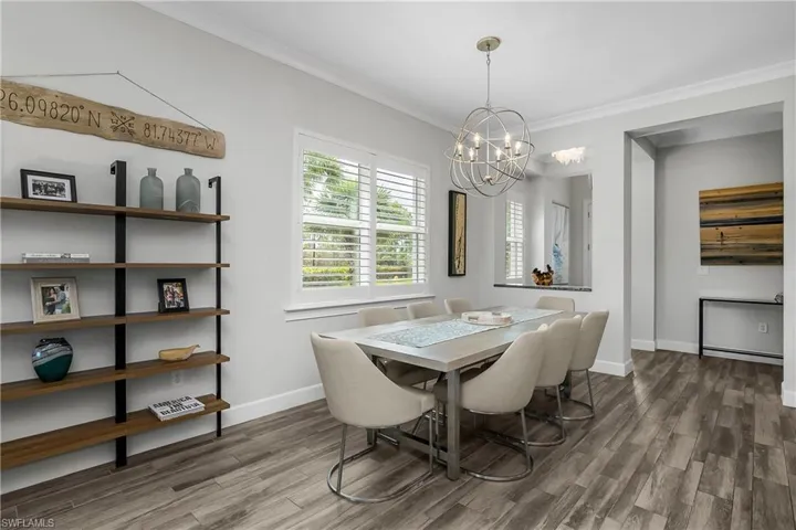 Dining space featuring crown molding, a chandelier, Note the Abundance of Natural Light