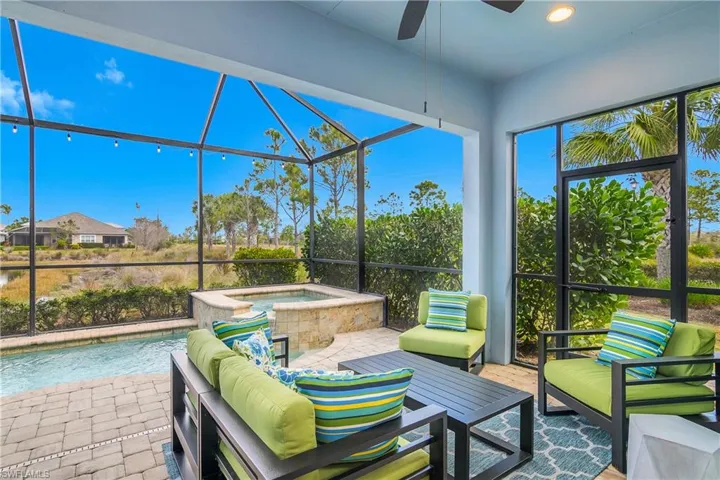 Screened Lanai with outdoor seating, a ceiling fan and great water views.