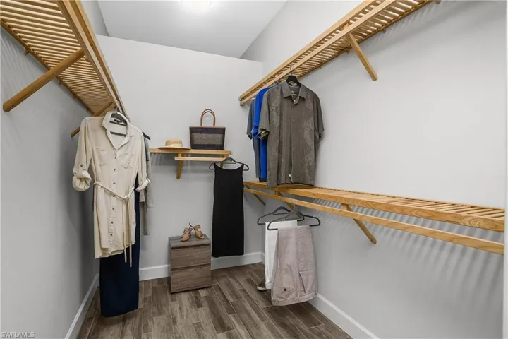 Walk in closet featuring loads of space.