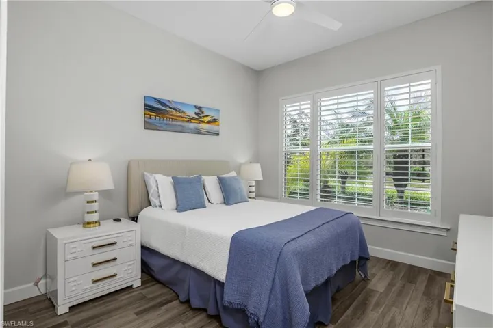 Guest Bedroom with Tile- flooring and ceiling fan, Plantation Shutters