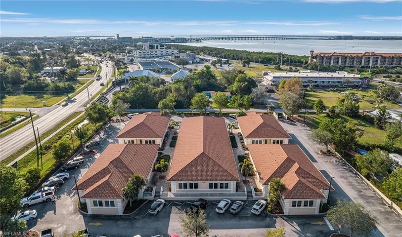 Drone / aerial view with a view of city and a water view