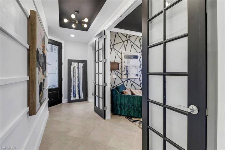 French Doors unveil the den.