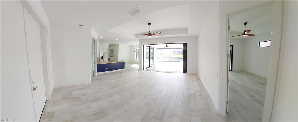 Spacious and Illuminating Living Room with pocket Impact sliders.