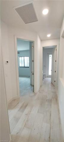 Hallway to guest bedrooms and pool bath