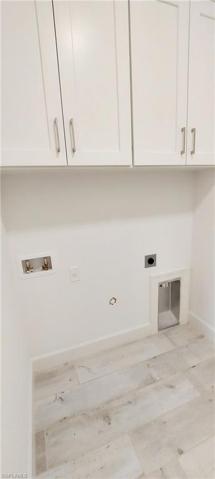 Laundry with upper cabinets