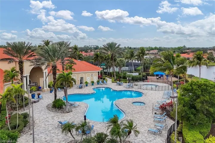 View of pool featuring a patio area and a hot tub