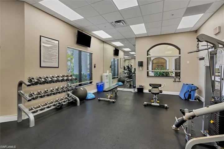 Exercise room featuring a drop ceiling