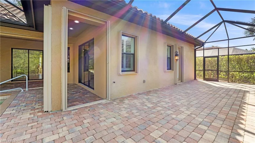 View of patio / terrace featuring a sunroom and a lanai