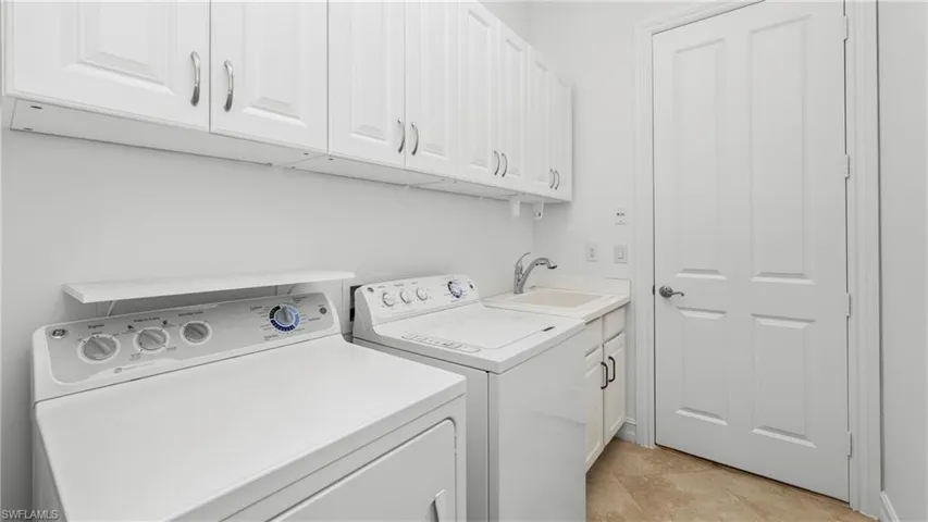 Laundry area with cabinet space and washer and dryer