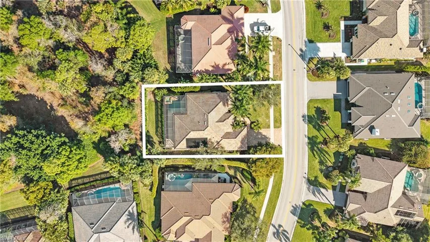 Aerial view of residential area with property parcel outlined