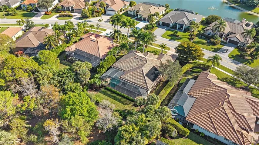 Aerial view of property's location featuring nearby suburban area and a nearby body of water