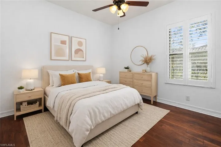 Virtually Staged Bedroom featuring dark wood-style flooring and a ceiling fan