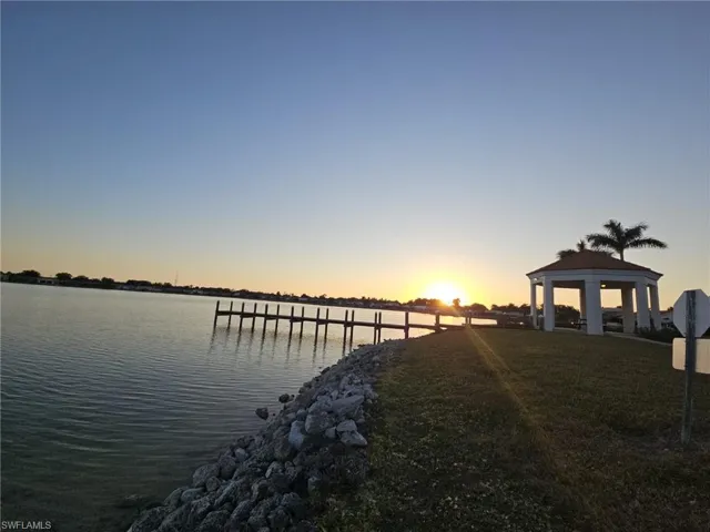 Dock area with a gazebo and a water view