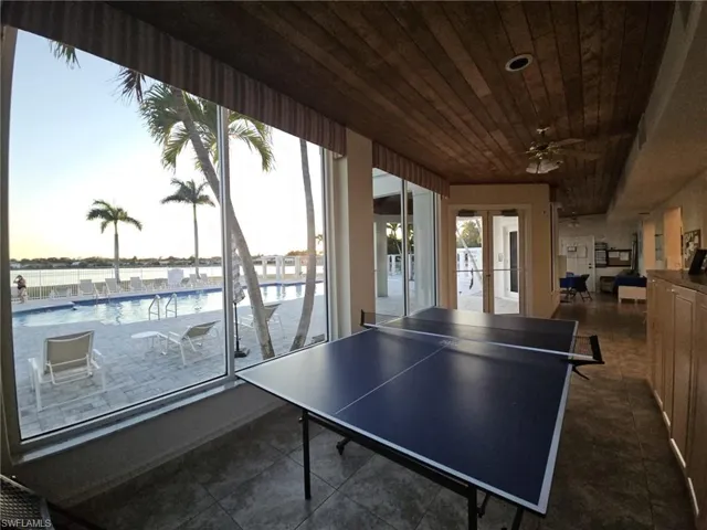 Playroom featuring ceiling fan, french doors, and wood ceiling