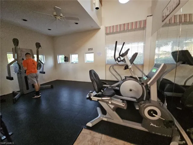 Exercise room featuring a ceiling fan