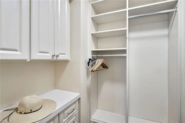 Spacious walk-in closet with nice built-ins