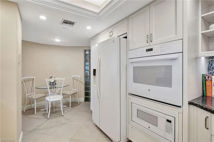 Eat-in area in the kitchen with glass block wall