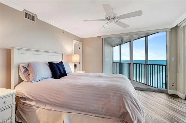 Bedroom with a Gulf view and access to private lanai