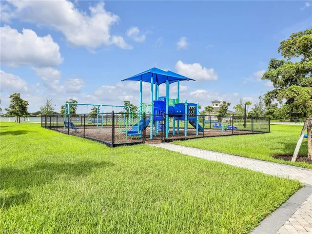 View of play area with a lawn