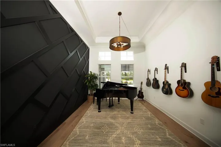 View of formal dining room with accent wall used as a music room