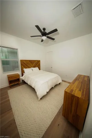 Bedroom featuring ceiling fan and hardwood / wood-style floors