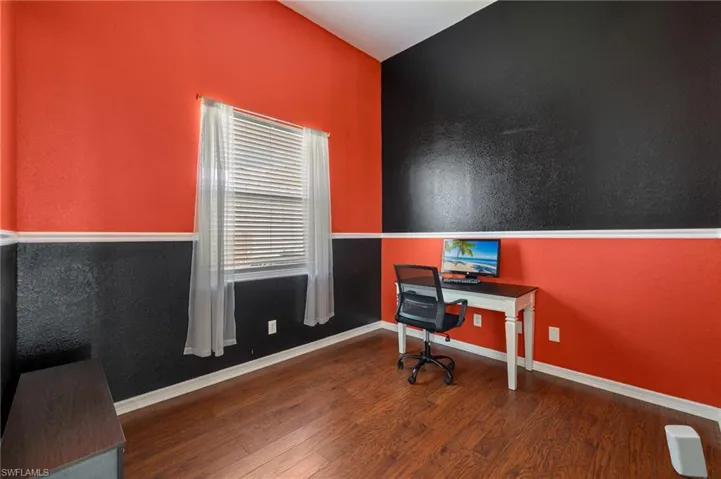 Office space featuring hardwood / wood-style flooring