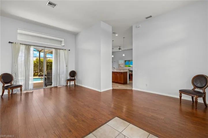 Sitting room with light tile patterned floors and ceiling fan