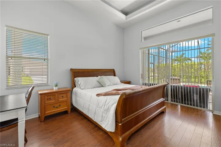 Bedroom with dark wood-type flooring