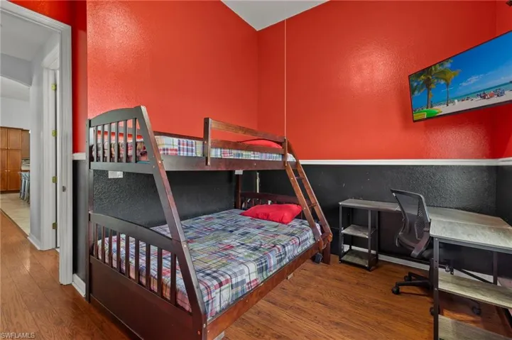 Bedroom featuring wood-type flooring