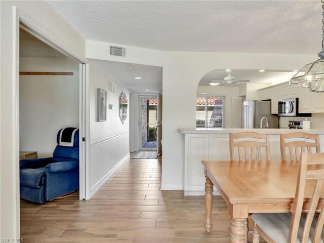 Hallway Showing Kitchen In The Front, Dining/Living Behind & Den Across