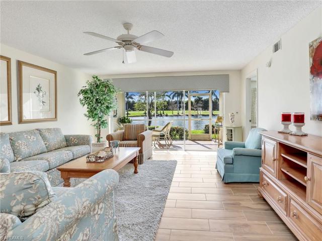 Upgraded Wood Plank Tile Flooring & View Overlooking Lake & Golf Course
