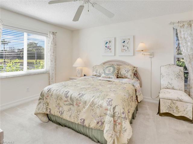 Primary Bedroom W/ Breathtaking Views of The Lake & Golf Course