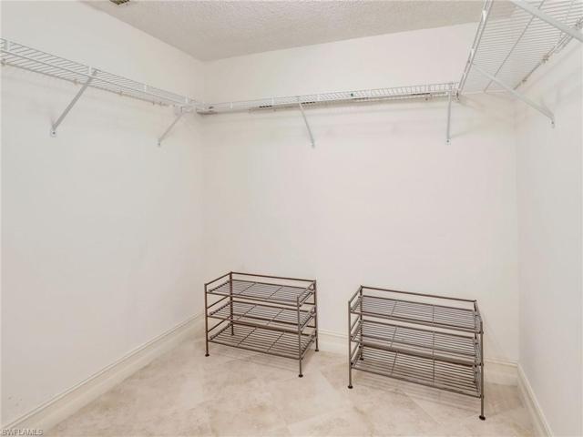 Primary Tiled Walk In Closet