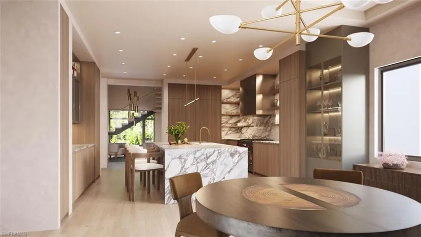 Kitchen and dining room with gourmet appliance package and hidden butler's pantry