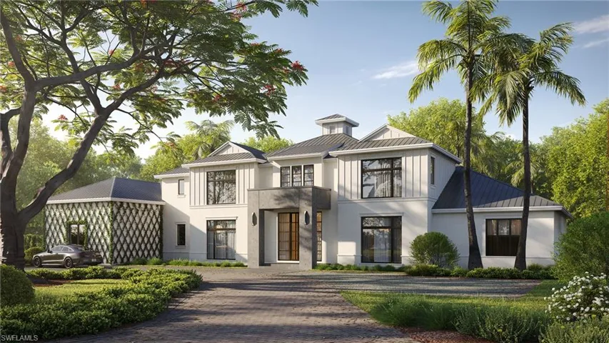 Modern farmhouse style home featuring a standing seam metal roof, old growth statement trees, and curved driveway
