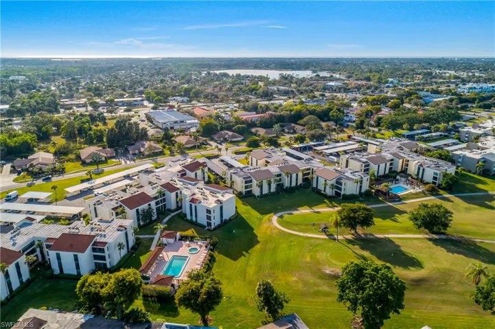 Aerial view of property's location with a pool area