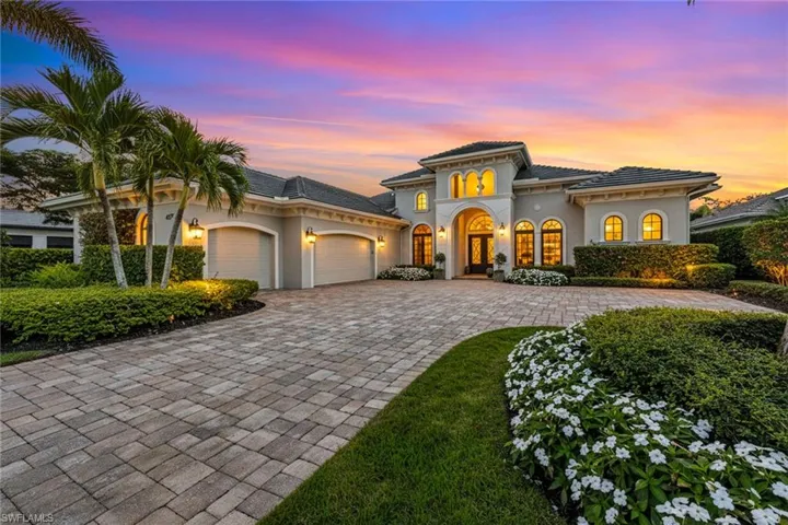 Mediterranean / spanish-style home featuring a garage, stucco siding, and decorative driveway