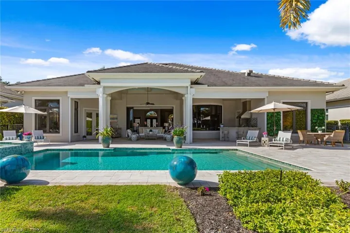 View of pool with a patio, outdoor lounge area, a pool with connected hot tub, and outdoor dining space