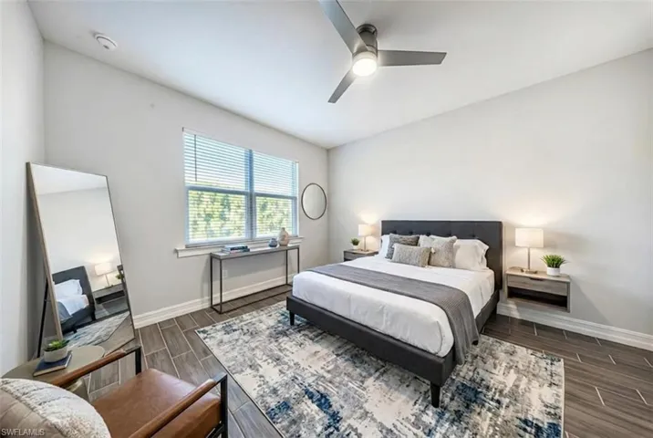 Bedroom with wood finish floors and a ceiling fan