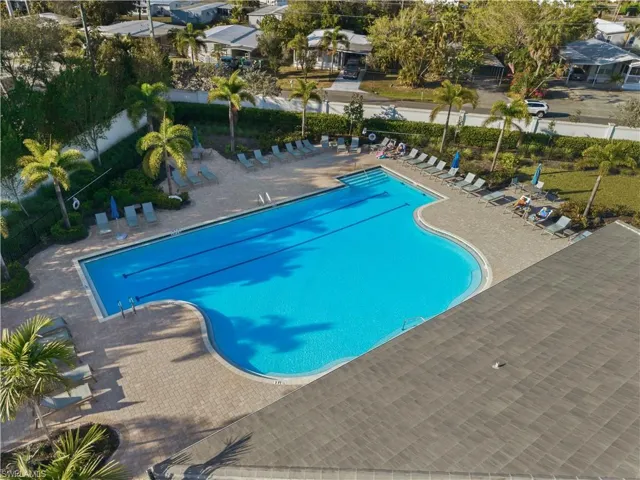 Community pool featuring a patio