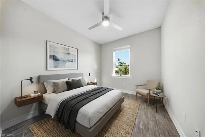 Bedroom featuring a ceiling fan and wood finish floors