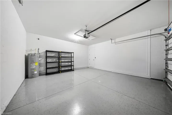 Garage featuring water heater