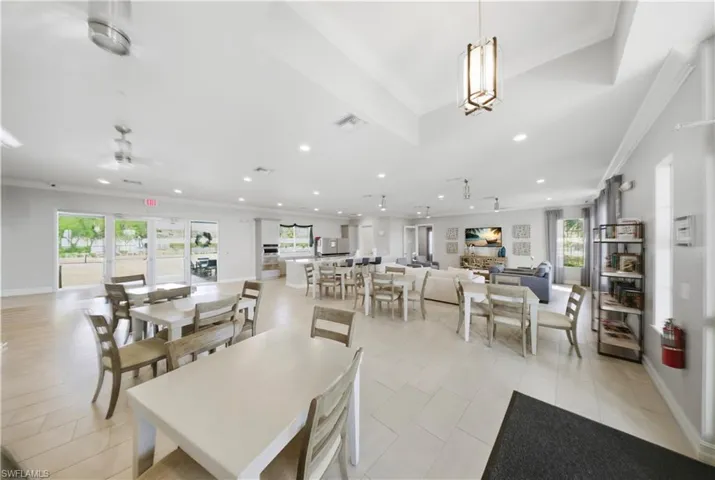 Dining area featuring ornamental molding, ceiling fan, recessed lighting, and light tile patterned floors