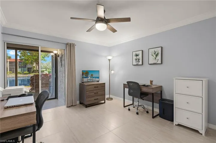 Office area with ceiling fan, ornamental molding, and baseboards